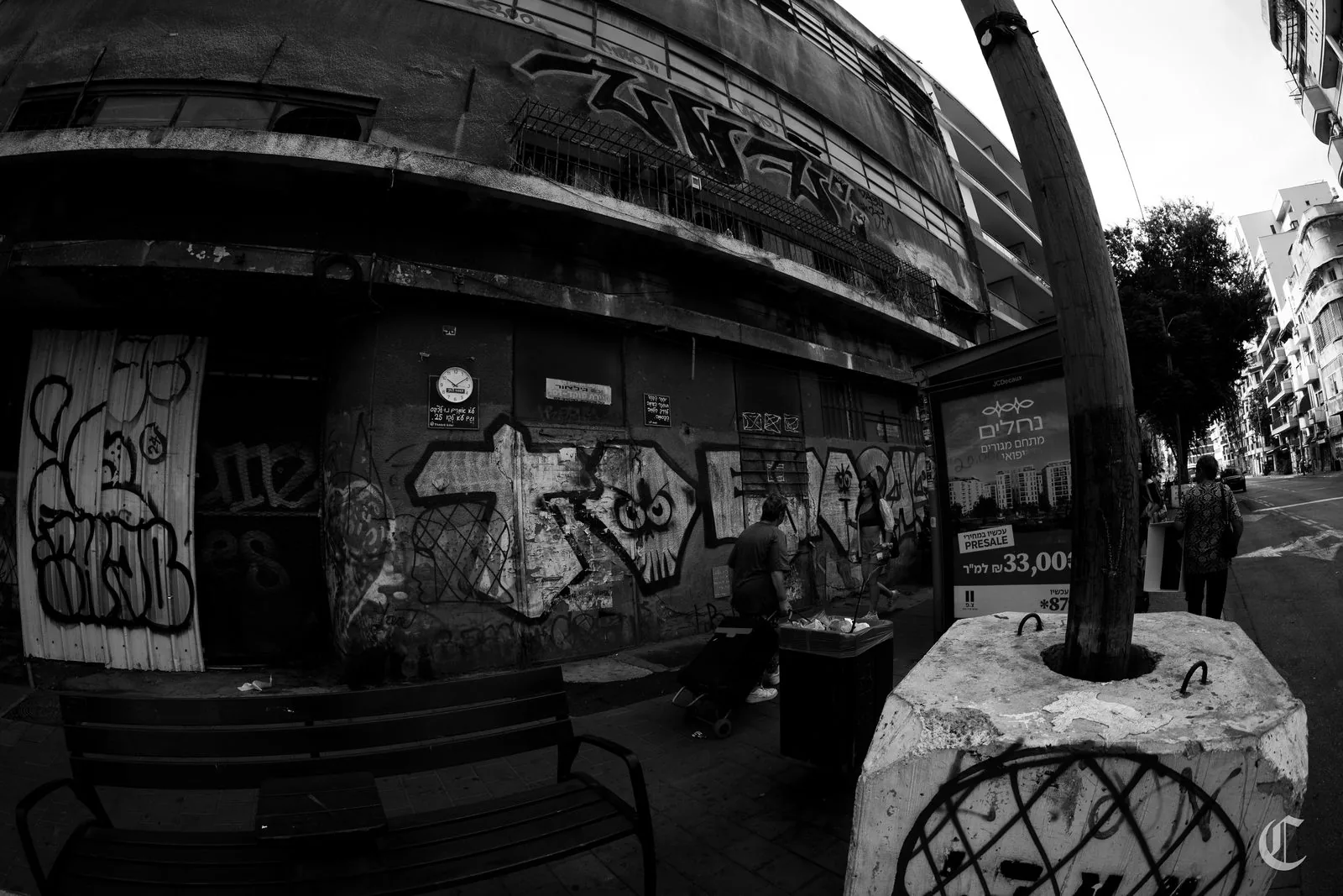 Bus stop on a graffiti wall, south Tel Aviv