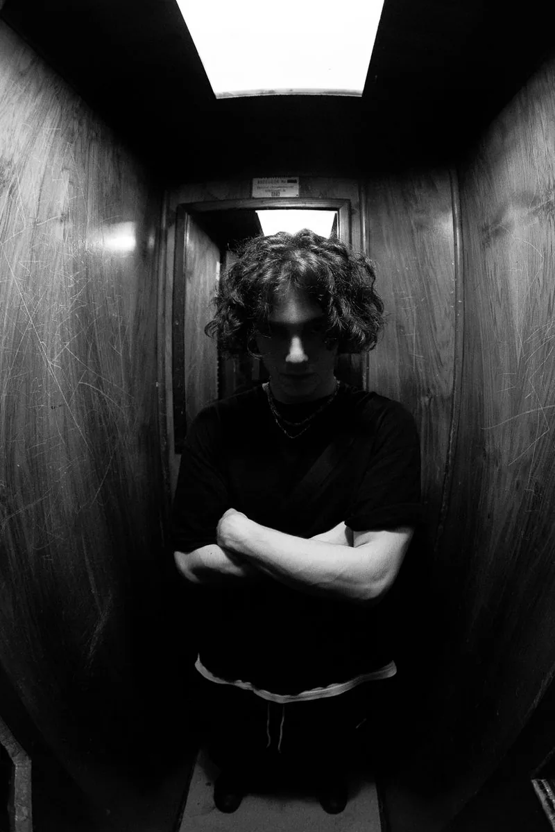 Artist portrait in a narrow corridor, fisheye