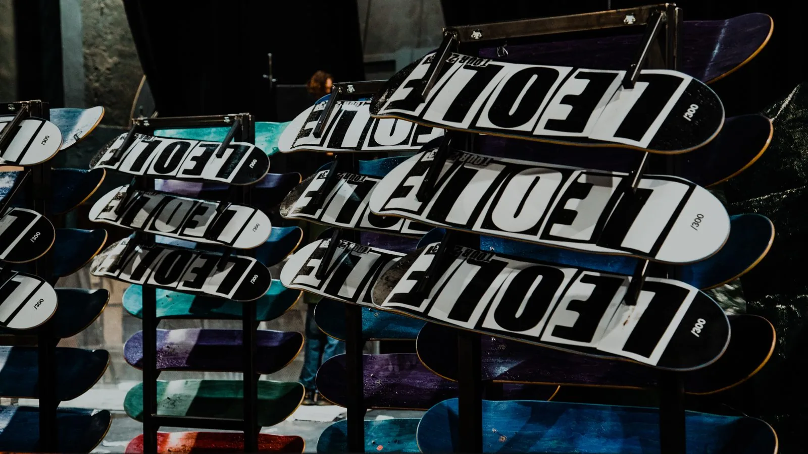 Branded skate decks racked at a venue