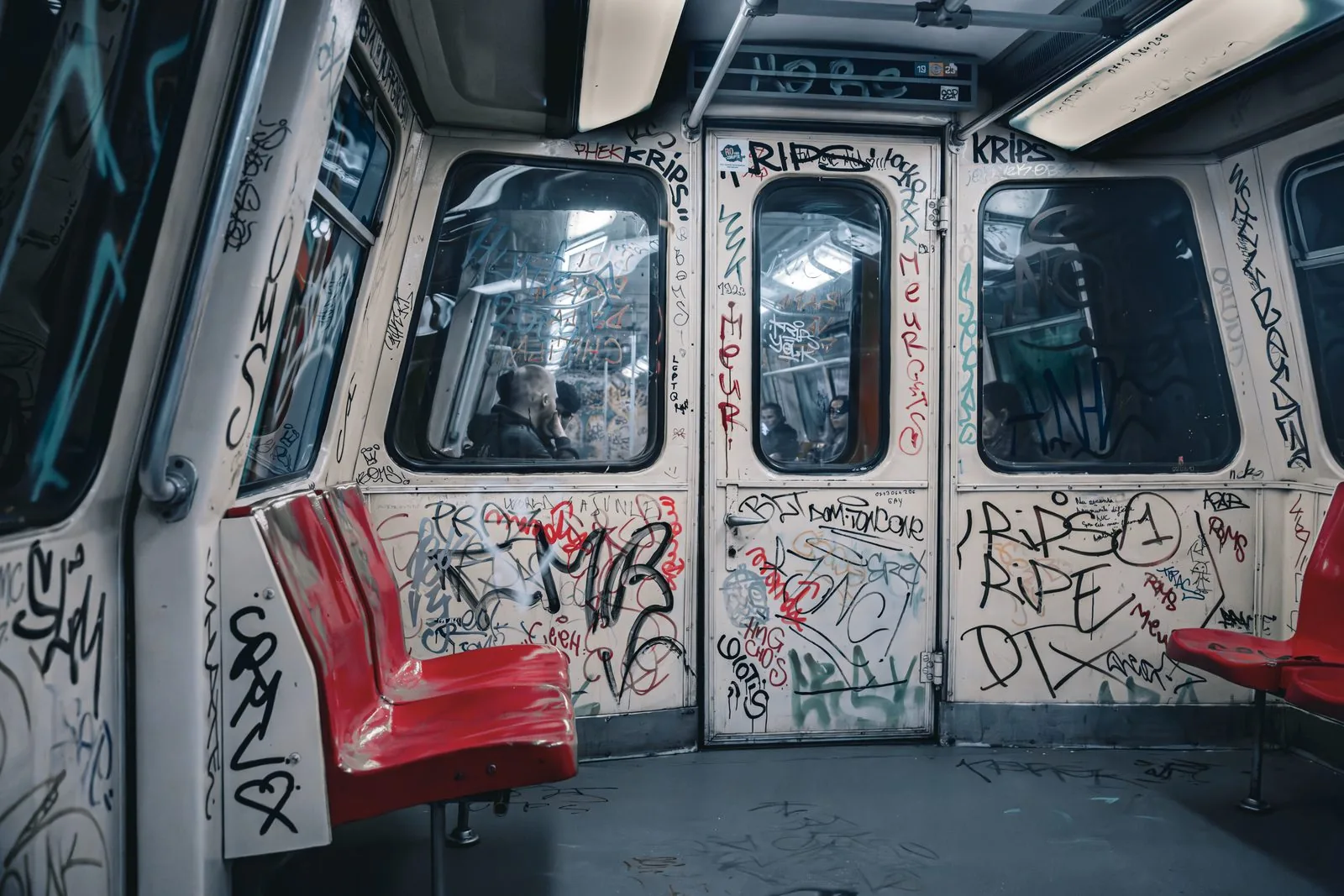 Bucharest metro doors, tags in black, red, silver
